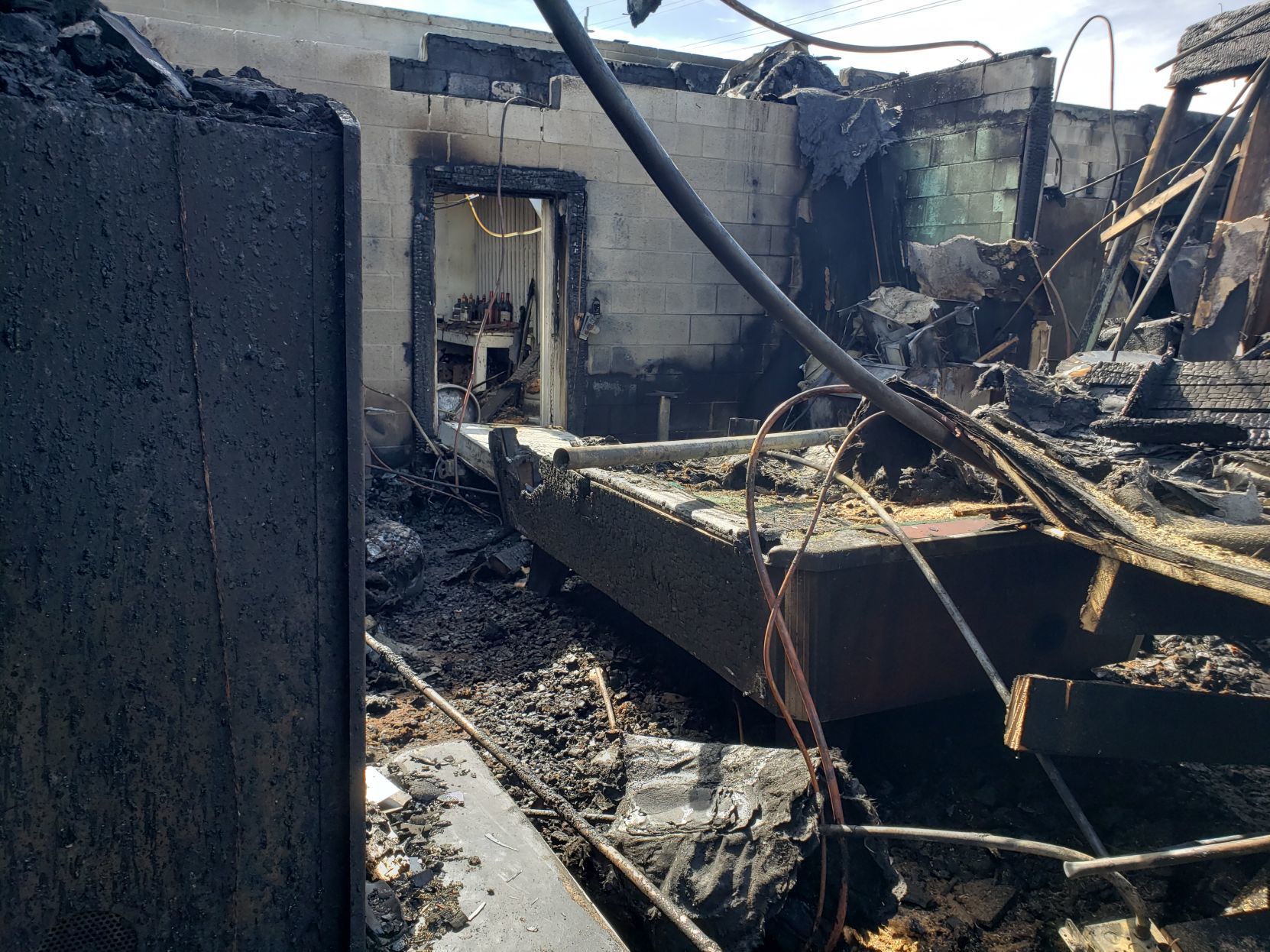 Burned pool table at 5 mile Bar